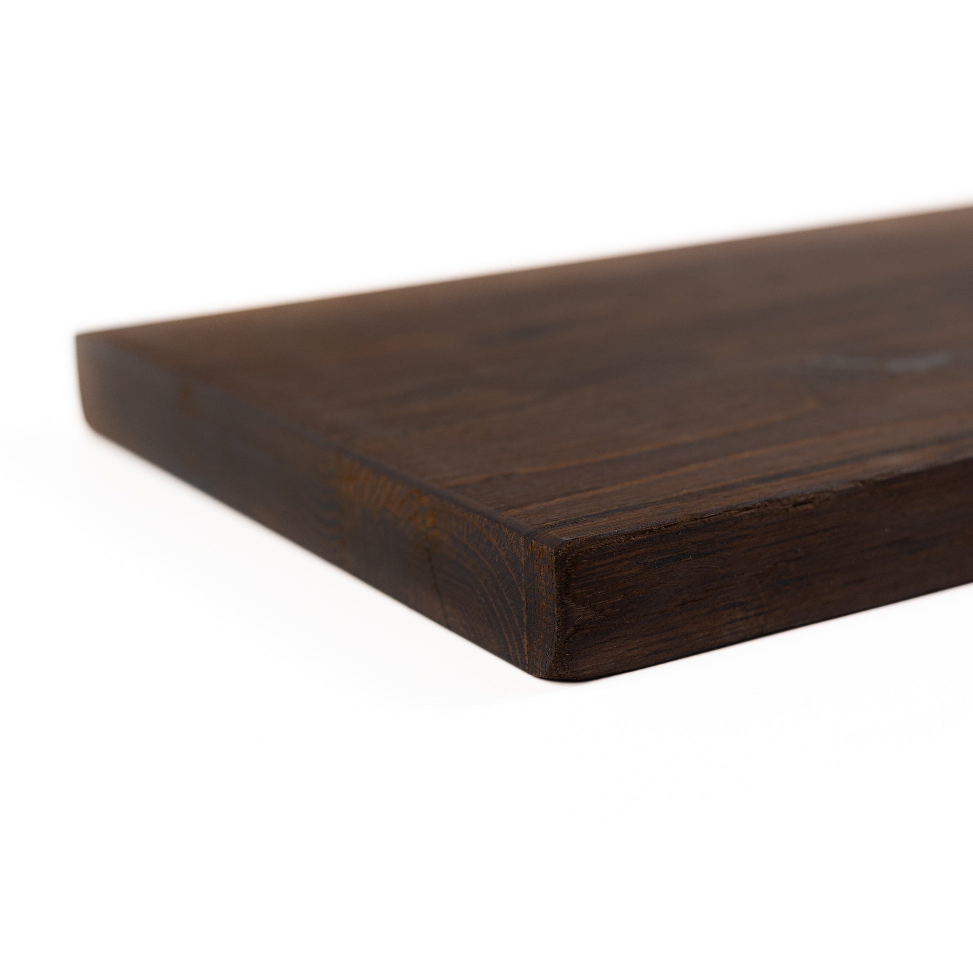 Close-up of dark oak wood grain and live edge detail