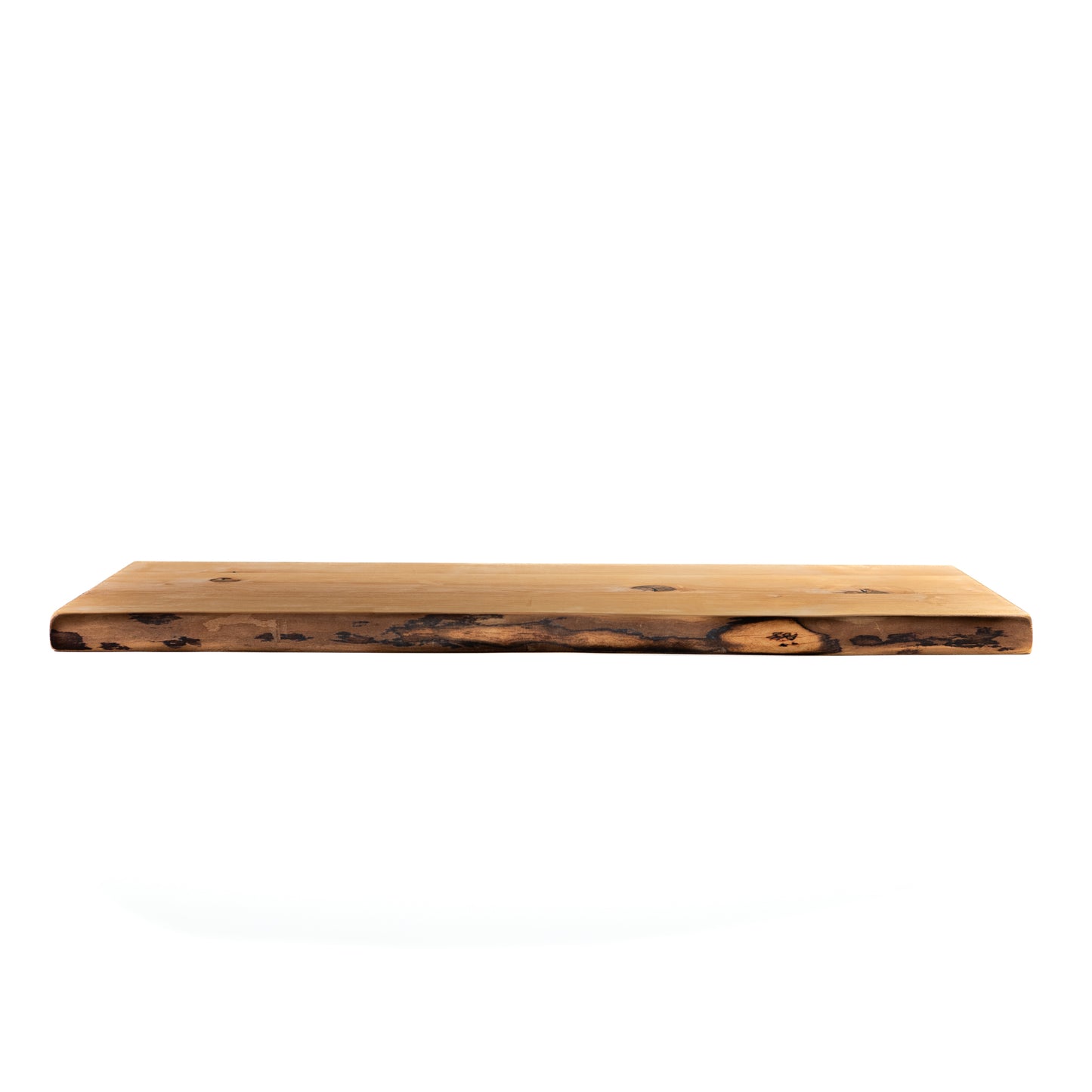 Side view of red wood floating shelf showing thickness
