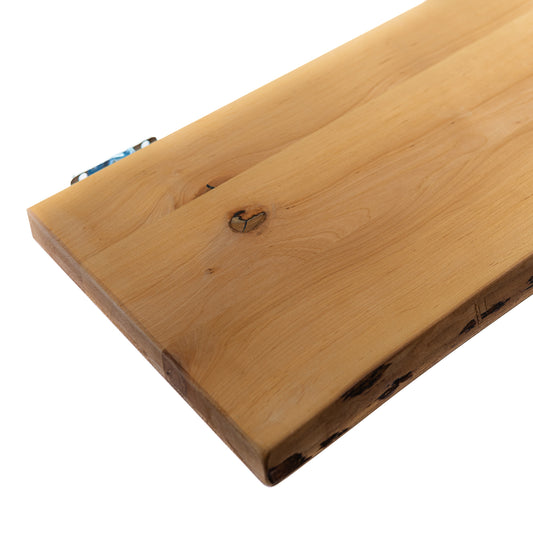 Red wood live-edge floating shelf mounted on wall