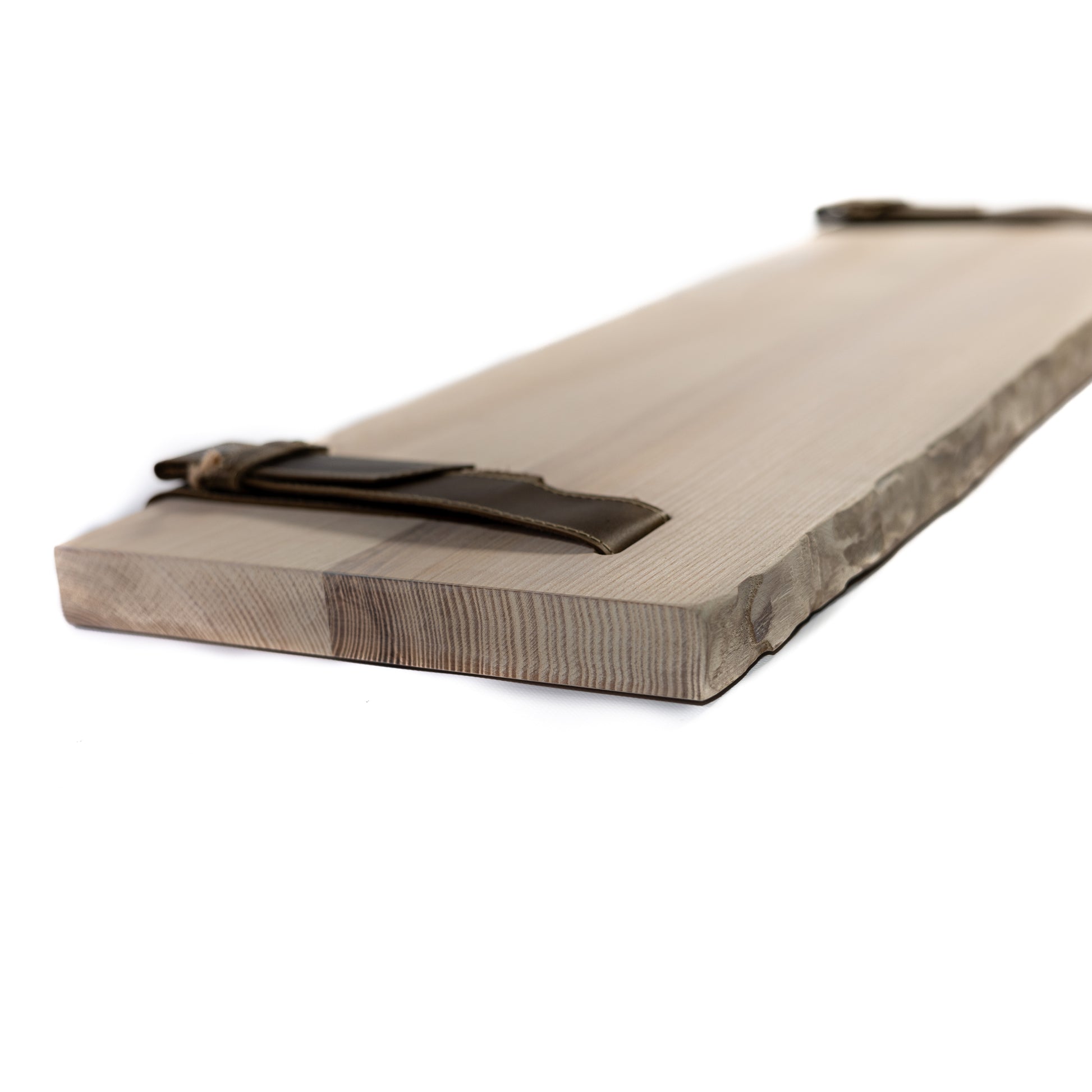 Natural birch bark pine shelf showing smooth edges and grain on white background