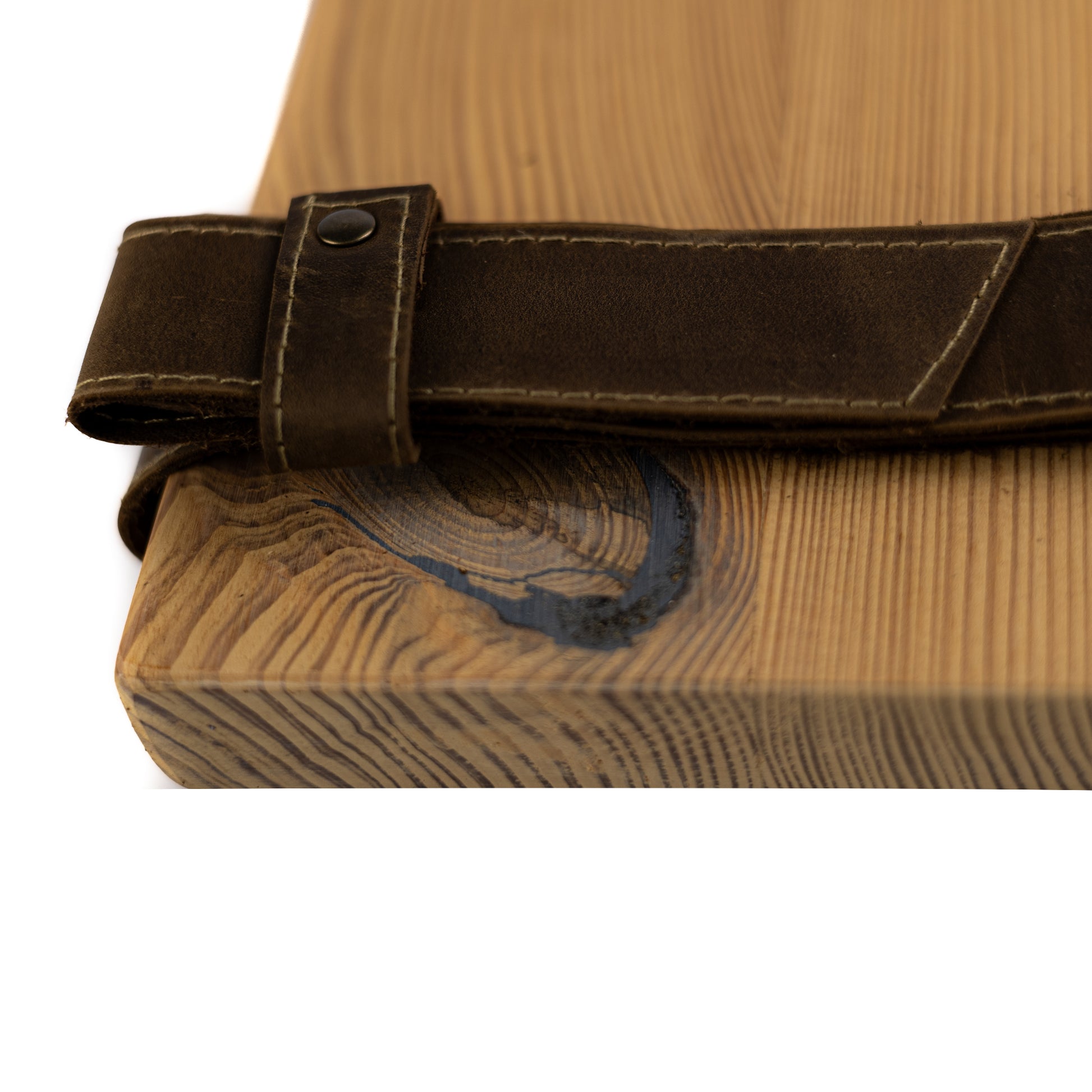 Close-up of natural pine wood grain and genuine leather straps